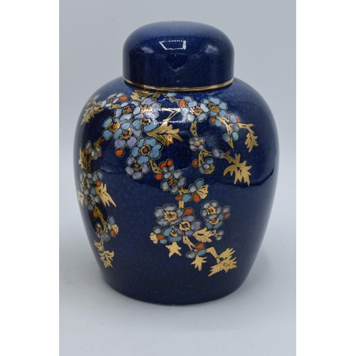 178 - Royal Winton Grimwades floral and gilt ginger jar on dark blue background together with floral vase ... 