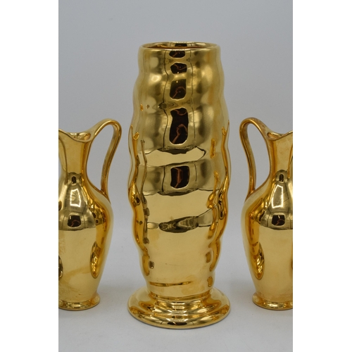 179 - A collection of Royal Winton Grimwades jugs and vases in gold and silver lustres (5). Tallest 26cm t... 