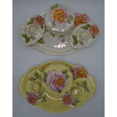 182 - A pair of Royal Winton Grimwades dressing table sets in floral lustre designs to consist of a tray, ... 