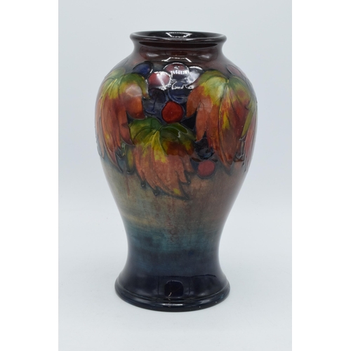 200 - Moorcroft Flambe Leaf and Berry inverse baluster vase, circa 1930s, 24cm tall (Restoration to base).