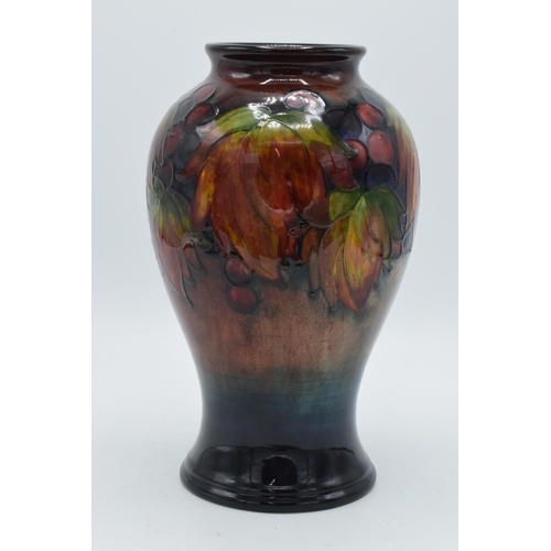 200 - Moorcroft Flambe Leaf and Berry inverse baluster vase, circa 1930s, 24cm tall (Restoration to base).