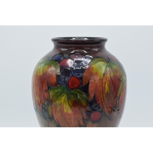 200 - Moorcroft Flambe Leaf and Berry inverse baluster vase, circa 1930s, 24cm tall (Restoration to base).