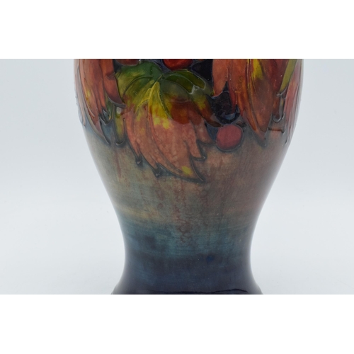 200 - Moorcroft Flambe Leaf and Berry inverse baluster vase, circa 1930s, 24cm tall (Restoration to base).