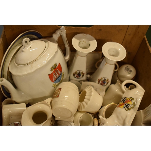 21 - A large collection of mainly crested china from across the country to include vases, jugs, bowls, mo... 