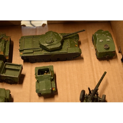 212 - A collection of Dinky toys to include military vehicles such as Centurion Tank, 7.2 Howitzer, 5.5 Me... 