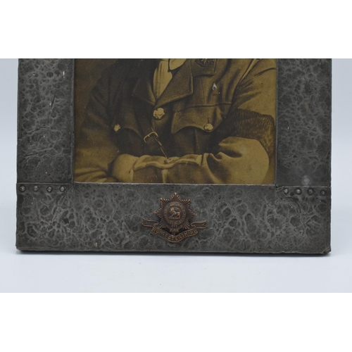 237 - Arts and Crafts pewter rectangular easel-back photo frame with Worcestershire Firm logo to bottom ce... 