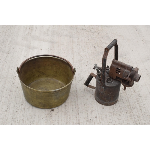 244 - A large antique brass jam pan, 36cm diameter, and a large vintage blow torch, 44cm tall (2). Both un... 