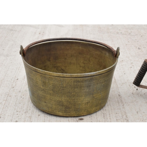 244 - A large antique brass jam pan, 36cm diameter, and a large vintage blow torch, 44cm tall (2). Both un... 