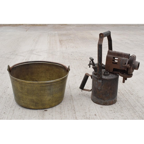 244 - A large antique brass jam pan, 36cm diameter, and a large vintage blow torch, 44cm tall (2). Both un... 