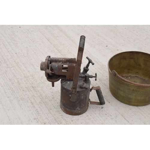 244 - A large antique brass jam pan, 36cm diameter, and a large vintage blow torch, 44cm tall (2). Both un... 