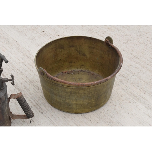 244 - A large antique brass jam pan, 36cm diameter, and a large vintage blow torch, 44cm tall (2). Both un... 