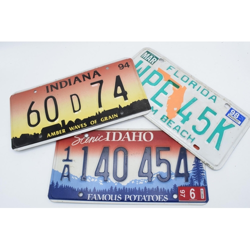 245E - A collection of vintage American car registration plates  / number plates to include Indiana and Flo... 