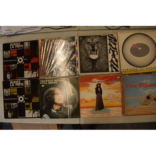 245G - A collection of vinyl records to include artists such as Eric Clapton, Yes, Wishbone Ash and other s... 