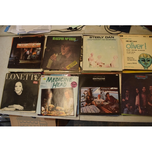 245G - A collection of vinyl records to include artists such as Eric Clapton, Yes, Wishbone Ash and other s... 