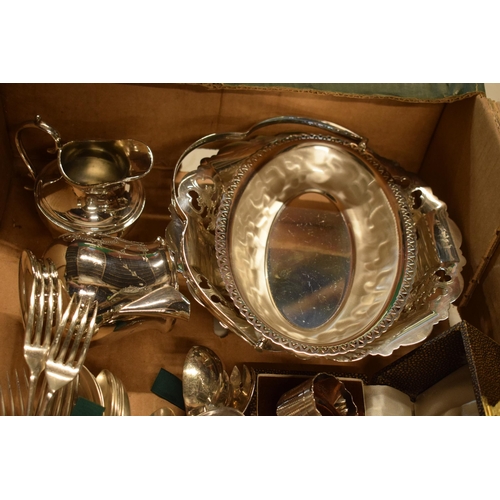 265 - A collection of silver plated items to include cutlery sets, a basket, cream jugs, cutlery and a Piq... 