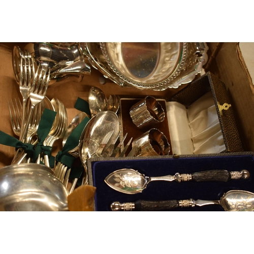 265 - A collection of silver plated items to include cutlery sets, a basket, cream jugs, cutlery and a Piq... 