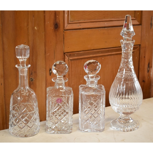 267 - A collection of decanters to include a Royal Albert cut glass examples and 3 similar examples.