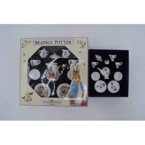 270 - A pair of Reutter of Germany Beatrix Potter miniature tea sets in boxes (2).