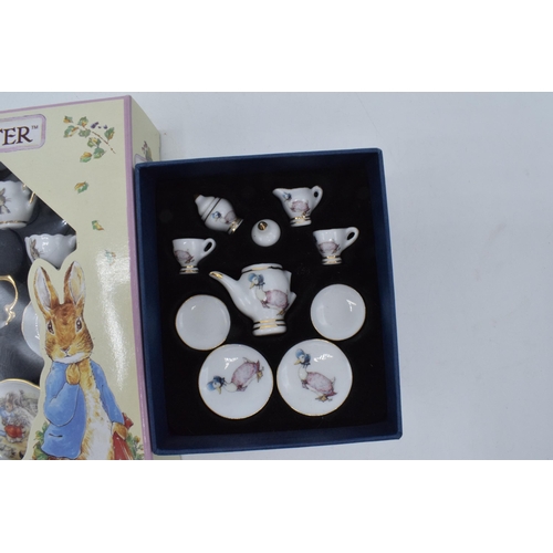 270 - A pair of Reutter of Germany Beatrix Potter miniature tea sets in boxes (2).