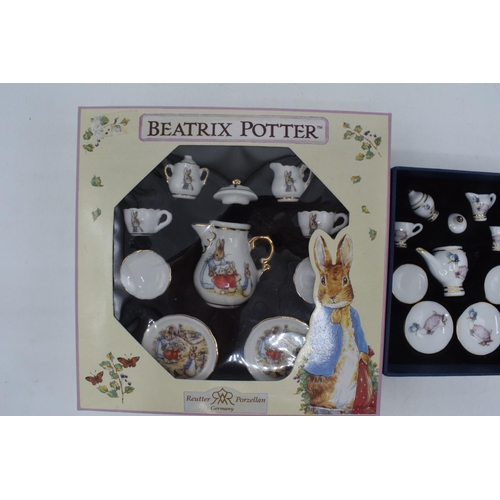 270 - A pair of Reutter of Germany Beatrix Potter miniature tea sets in boxes (2).