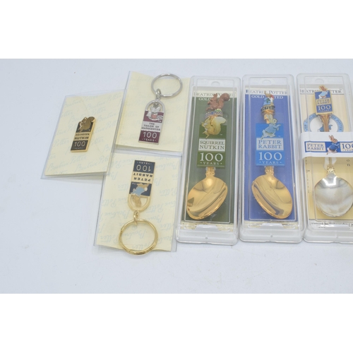 271 - A collection of Beatrix Potter related items to include gold plated and enamelled centenary tea spoo... 