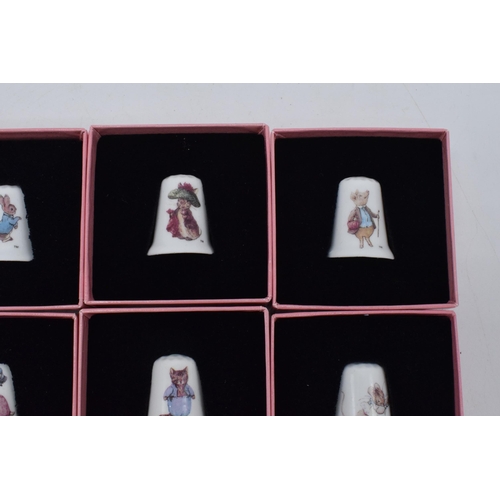 273 - The World of Beatrix Potter full set of twelve bone china thimbles with original boxes (12).