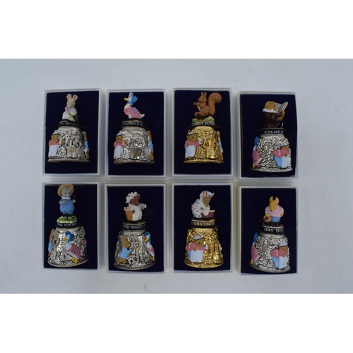 274 - A collection of Beatrix Potter Centenary gold plated thimbles together with 6 silver plated figural ... 