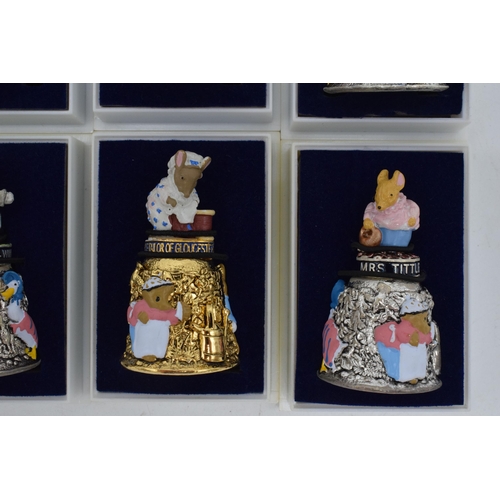 274 - A collection of Beatrix Potter Centenary gold plated thimbles together with 6 silver plated figural ... 