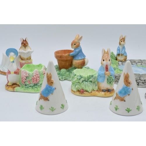 280 - A collection of Beatrix Potter ceramic items to include 5 x Enesco egg cups, an Enesco soap dish, Bo... 