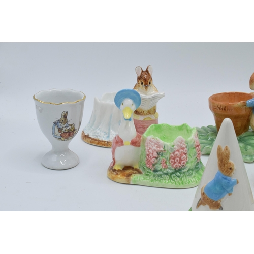 280 - A collection of Beatrix Potter ceramic items to include 5 x Enesco egg cups, an Enesco soap dish, Bo... 