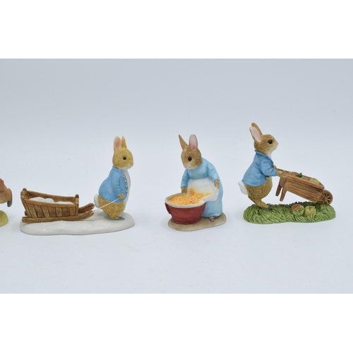 281 - A collection of Border Fine Arts Studio World of Beatrix Potter figures to include Peter Pushing Whe... 