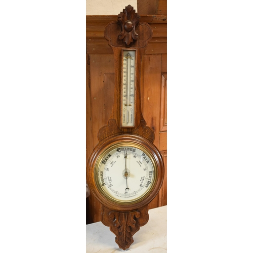 299 - An Edwardian wooden onion-shaped aneroid barometer, 88cm tall. Collection only due to the Mercury co... 