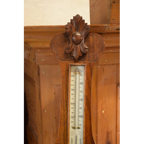 299 - An Edwardian wooden onion-shaped aneroid barometer, 88cm tall. Collection only due to the Mercury co... 