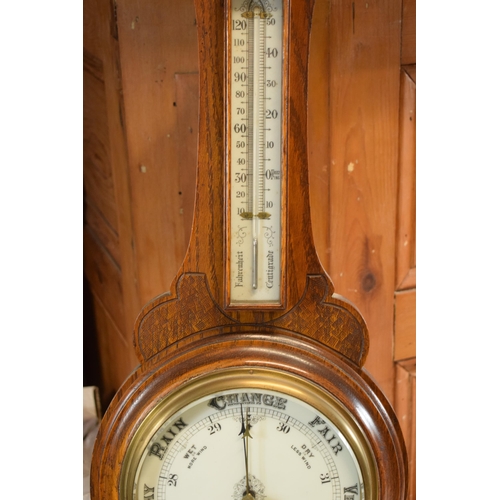 299 - An Edwardian wooden onion-shaped aneroid barometer, 88cm tall. Collection only due to the Mercury co... 