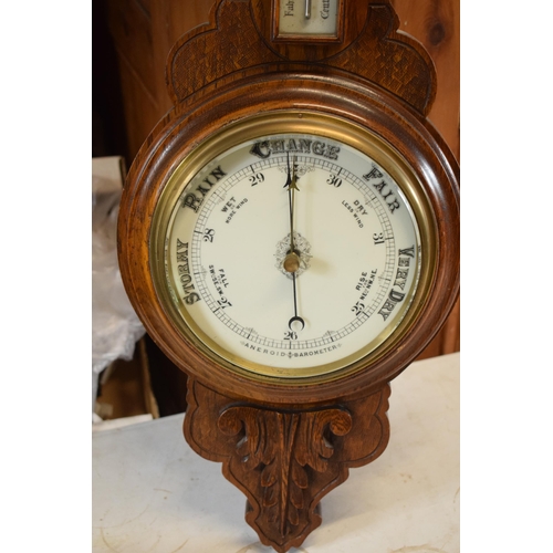 299 - An Edwardian wooden onion-shaped aneroid barometer, 88cm tall. Collection only due to the Mercury co... 