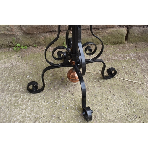 303 - A tall and adjustable metal and copper freestanding lamp with twisted iron work, 156cm tall.