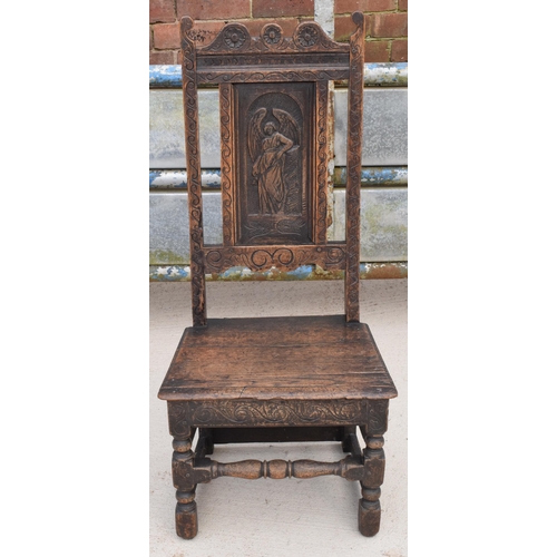 306 - An early to mid 19th century Wainscot-style oak chair with carved back panel, 108cm tall.