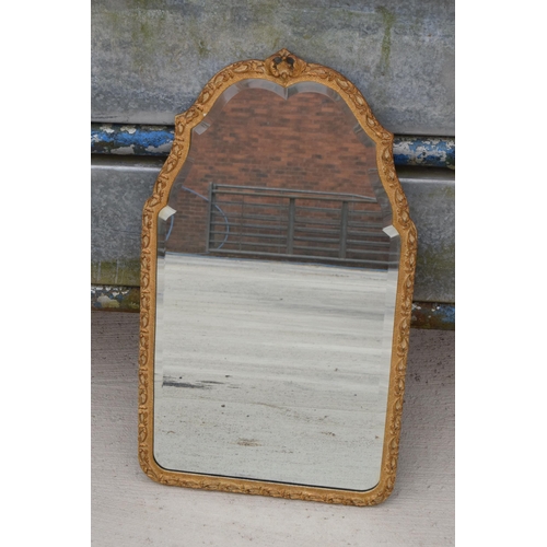 308 - A vintage mid 20th century gilt-style wall mirror, 75cm tall.