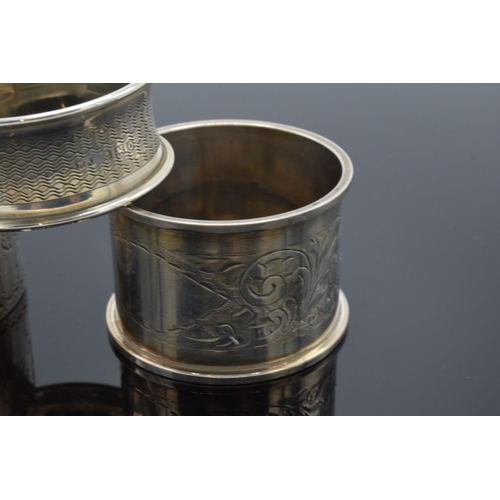 323 - A trio of silver napkin rings to include Birmingham 1897, 1917 and Chester 1905 (3). 52.3 grams.