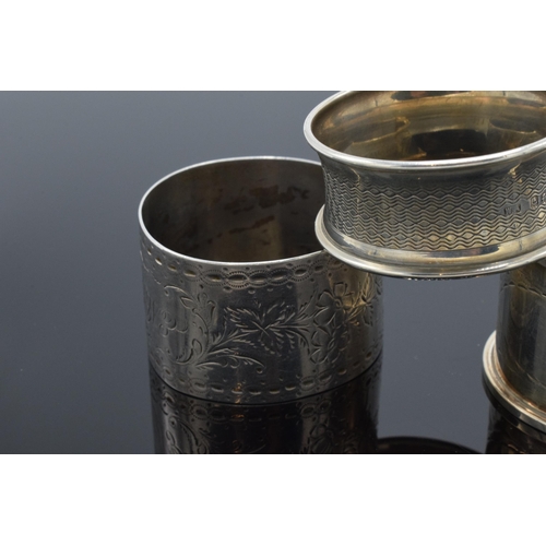 323 - A trio of silver napkin rings to include Birmingham 1897, 1917 and Chester 1905 (3). 52.3 grams.