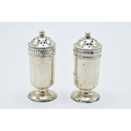 328 - A pair of silver shakers, 62.2 grams. 7.5cm tall. Birmingham 1910.