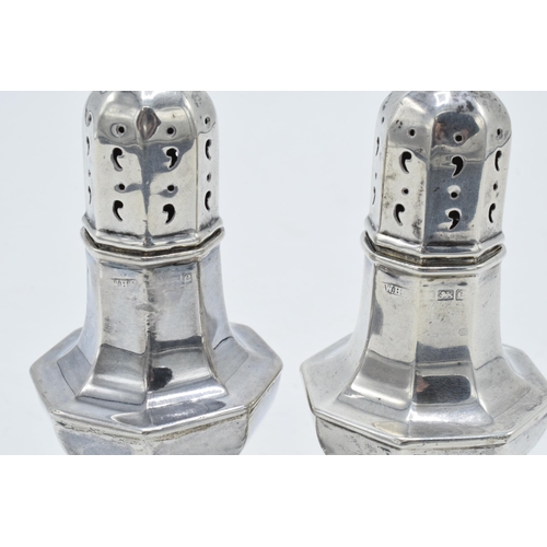 330 - A pair of silver sugar shakers 61.9 grams. Birmingham 1904. 10cm tall.