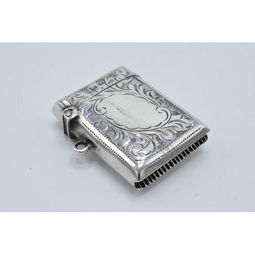 332 - Silver vesta case with floral decoration and vacant cartouche. Birmingham 1945. 14.9 grams.