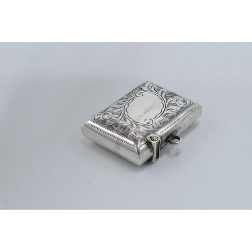 332 - Silver vesta case with floral decoration and vacant cartouche. Birmingham 1945. 14.9 grams.