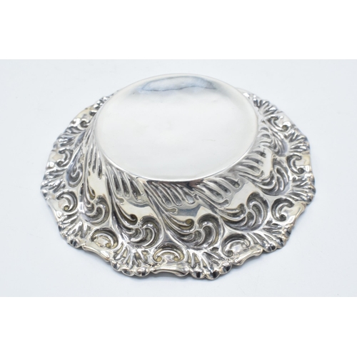 335 - Silver sweet / bonbon dish with repousse decoration. Sheffield 1897. 51.0 grams. 12cm diameter.