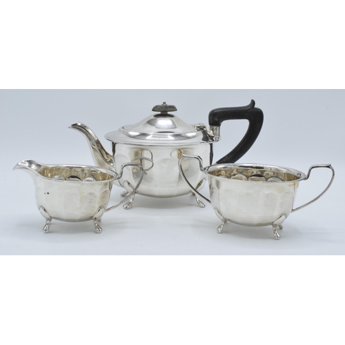 344 - A silver 3-piece tea set to include a teapot with ebonised handle, sugar bowl and milk jug (3). Gros... 