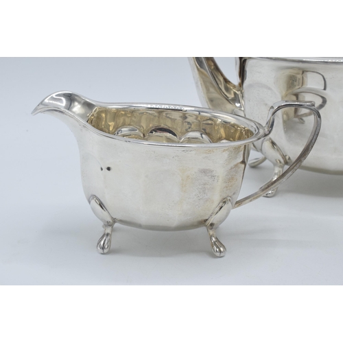 344 - A silver 3-piece tea set to include a teapot with ebonised handle, sugar bowl and milk jug (3). Gros... 