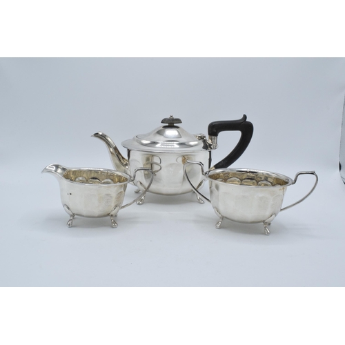 344 - A silver 3-piece tea set to include a teapot with ebonised handle, sugar bowl and milk jug (3). Gros... 