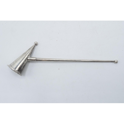 347 - A hallmarked silver candle snuffer, London 1986, D J Anderson. 14cm long.