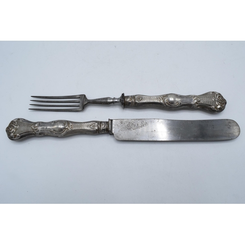 349 - A silver-handled knife and fork set, Prague, circa 1850 (2). 24cm long.